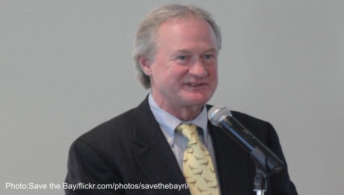 Lincoln Chafee speaking from a podium in Rhode Island